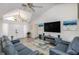 Living room with vaulted ceiling and fireplace at 2250 Rio De Janeiro Ave, Punta Gorda, FL 33983