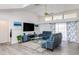 Living room with vaulted ceiling, hardwood floors, and view of pool at 2250 Rio De Janeiro Ave, Punta Gorda, FL 33983