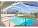 Relaxing pool and patio area with covered enclosure at 2250 Rio De Janeiro Ave, Punta Gorda, FL 33983