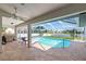 Inviting pool area with covered patio, grill, and ample seating at 2250 Rio De Janeiro Ave, Punta Gorda, FL 33983