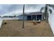 Large backyard with grassy area and fire pit at 23917 Pow Wow Dr, Lutz, FL 33559