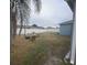 Fenced backyard with fire pit and seating area at 23917 Pow Wow Dr, Lutz, FL 33559