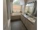 Bathroom with double vanity, soaking tub, and separate shower at 23917 Pow Wow Dr, Lutz, FL 33559