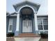 Grand entrance with arched entryway and columns at 23917 Pow Wow Dr, Lutz, FL 33559