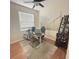 Bright home office with hardwood floors and built-in shelving at 23917 Pow Wow Dr, Lutz, FL 33559