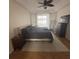 Main bedroom with a king-size bed, large windows, and ample space at 23917 Pow Wow Dr, Lutz, FL 33559