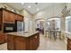 Open concept kitchen with island and breakfast bar at 26722 Winged Elm Dr, Wesley Chapel, FL 33544