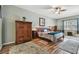 Spacious main bedroom with wood flooring, ceiling fan, and ample natural light at 26722 Winged Elm Dr, Wesley Chapel, FL 33544