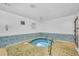 Relaxing hot tub with tiled surround at 320 Medallion Blvd # D, Madeira Beach, FL 33708