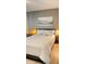 Main bedroom with a king-size bed and tasteful decor at 320 Medallion Blvd # D, Madeira Beach, FL 33708