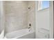 Clean bathroom with a shower and bathtub at 33764 Ocean Spray Ln, Wesley Chapel, FL 33543