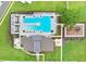 An overhead view of the community pool and recreation facilities, including a playground, and lounging area at 36401 Camp Fire Ter, Zephyrhills, FL 33541