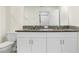Bathroom boasts double sinks and granite countertops at 36401 Camp Fire Ter, Zephyrhills, FL 33541