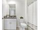 Guest bathroom with granite vanity and shower at 36401 Camp Fire Ter, Zephyrhills, FL 33541