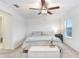 Spacious bedroom with ceiling fan and neutral decor at 36401 Camp Fire Ter, Zephyrhills, FL 33541