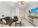 Bright and airy living room with a comfortable sectional sofa and modern decor at 36401 Camp Fire Ter, Zephyrhills, FL 33541