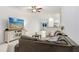 Spacious living room featuring a sectional sofa and a large flat-screen TV at 36401 Camp Fire Ter, Zephyrhills, FL 33541