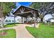 A peaceful community picnic shelter surrounded by green space and mature trees at 36401 Camp Fire Ter, Zephyrhills, FL 33541