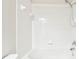 Clean bathroom with shower/tub combo and white tile at 4207 Key Thatch Dr, Tampa, FL 33610