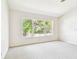 Bright bedroom with large window and ceiling fan at 4207 Key Thatch Dr, Tampa, FL 33610