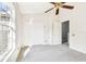 Bright bedroom with window, double door closet and ceiling fan at 4207 Key Thatch Dr, Tampa, FL 33610