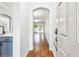 Bright entryway with hardwood floors leading to living room at 4207 Key Thatch Dr, Tampa, FL 33610
