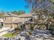 Aerial view of three-unit townhome building with garages at 4207 Key Thatch Dr, Tampa, FL 33610