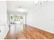Spacious living room with hardwood floors and sliding glass doors at 4207 Key Thatch Dr, Tampa, FL 33610