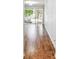 Hardwood floor living room with sliding glass doors at 4207 Key Thatch Dr, Tampa, FL 33610