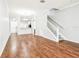 Open living area with hardwood floors and kitchen view at 4207 Key Thatch Dr, Tampa, FL 33610