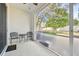 Screened patio with seating area and backyard view at 4207 Key Thatch Dr, Tampa, FL 33610