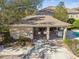 Community pool area with covered seating and restrooms at 4207 Key Thatch Dr, Tampa, FL 33610