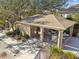 Community pool area with covered seating and restrooms at 4207 Key Thatch Dr, Tampa, FL 33610
