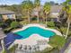 Community pool with plenty of lounge chairs at 4207 Key Thatch Dr, Tampa, FL 33610