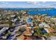 Aerial view of waterfront home with circular driveway at 4235 Moody St, St Pete Beach, FL 33706