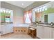 Elegant bathroom with a corner soaking tub, granite countertops, and double sinks at 4936 Sandy Brook Cir, Wimauma, FL 33598