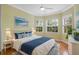 Comfortable guest bedroom with a queen-size bed and plenty of natural light at 4936 Sandy Brook Cir, Wimauma, FL 33598