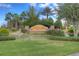 Valencia Lakes community entrance with water feature and landscaping at 4936 Sandy Brook Cir, Wimauma, FL 33598