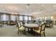 Spacious game room with multiple tables and chairs at 4936 Sandy Brook Cir, Wimauma, FL 33598