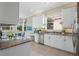Spacious kitchen with granite countertops, stainless steel appliances, and white cabinets at 4936 Sandy Brook Cir, Wimauma, FL 33598