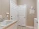 Bright laundry room with utility sink and built-in cabinets at 4936 Sandy Brook Cir, Wimauma, FL 33598