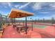 Modern pickleball courts with shaded seating area at 4936 Sandy Brook Cir, Wimauma, FL 33598