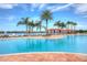 Large resort-style pool with cabanas and plenty of lounge chairs at 4936 Sandy Brook Cir, Wimauma, FL 33598