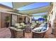 Relaxing outdoor lounge area with wicker furniture and water features at 5004 Sandy Brook Cir, Wimauma, FL 33598