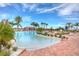 Relaxing pool area with a free-form design and plenty of seating at 5004 Sandy Brook Cir, Wimauma, FL 33598