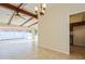 Living room with tile floors, ceiling fan, and sliding glass door at 51 Lexington Dr, Dunedin, FL 34698