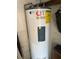 A Rheem Fury water heater with an energy guide and affordable inspections sticker at 51 Lexington Dr, Dunedin, FL 34698