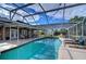 Expansive screened pool with plenty of lounge chairs at 517 65Th E Ave, Bradenton, FL 34203