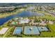 Aerial view of a community clubhouse featuring tennis, basketball, and swimming pool at 6032 Milestone Dr, Apollo Beach, FL 33572