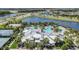Resort-style pool, tennis courts, and playground in a community at 6232 Sea Air Dr, Apollo Beach, FL 33572